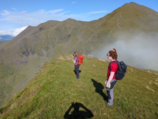 Patch of dense fog behind 2 walkers